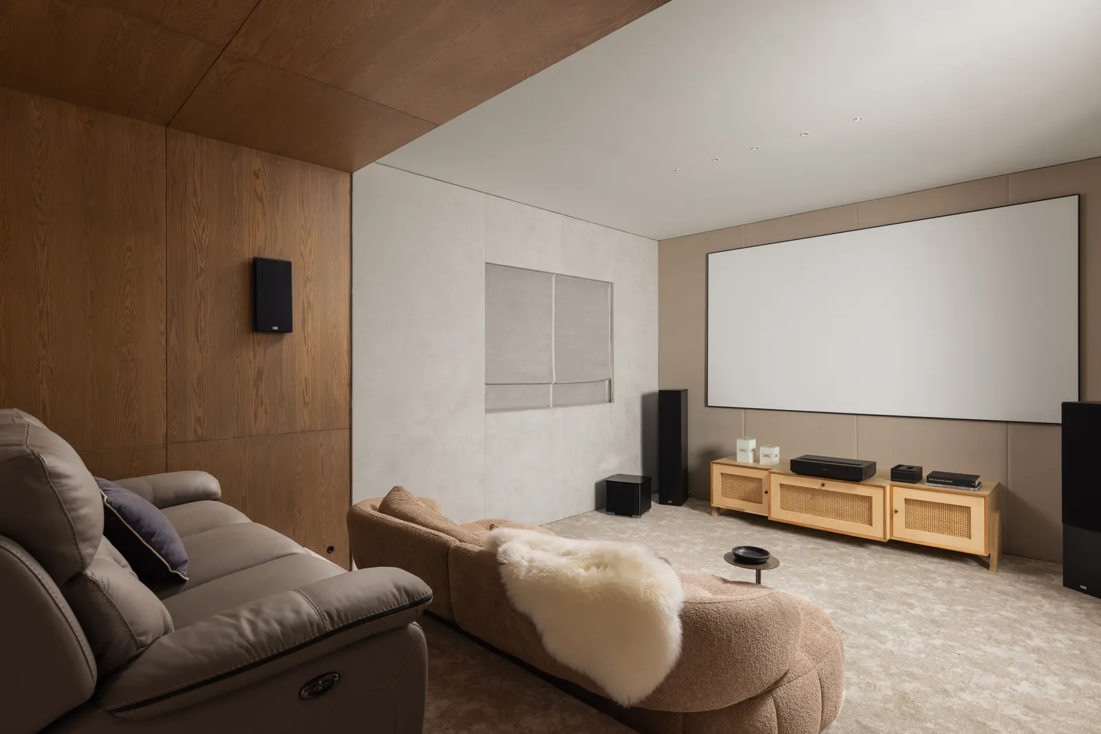 Home theatre with projector screen and recliner sofas — Seema Katta Svasa